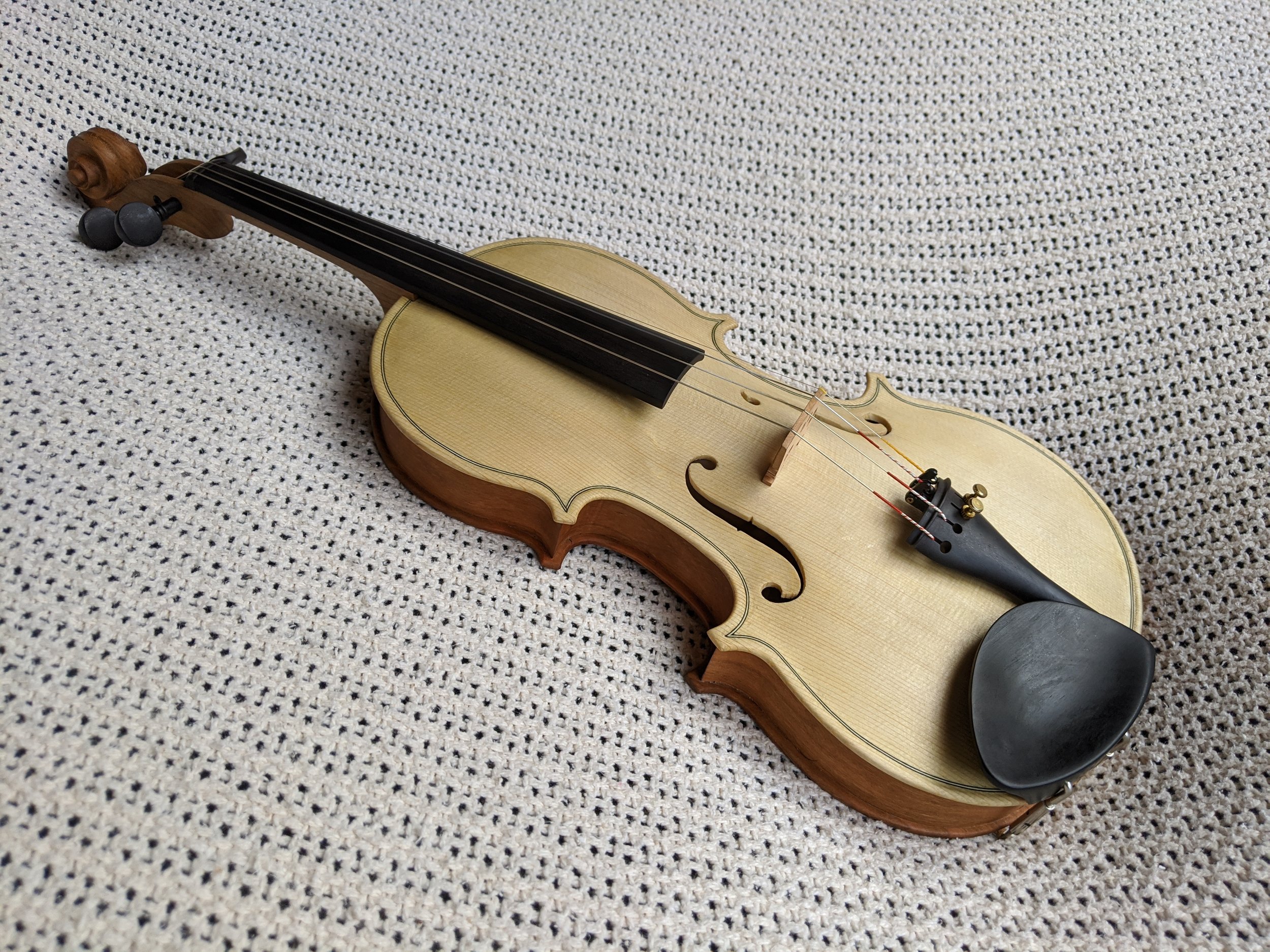 A homemade violin made of cherry wood and spruce.