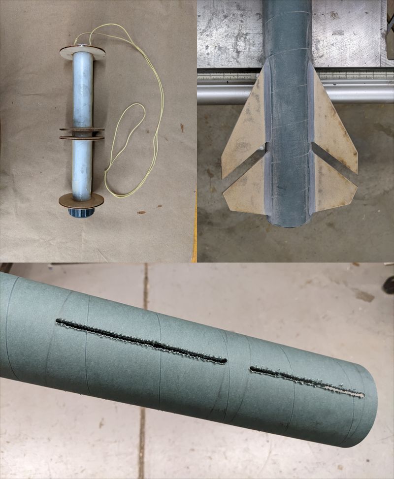 Aft end of rocket during manufacturing showing motor mount tube, fin slots, and final fin assembly.